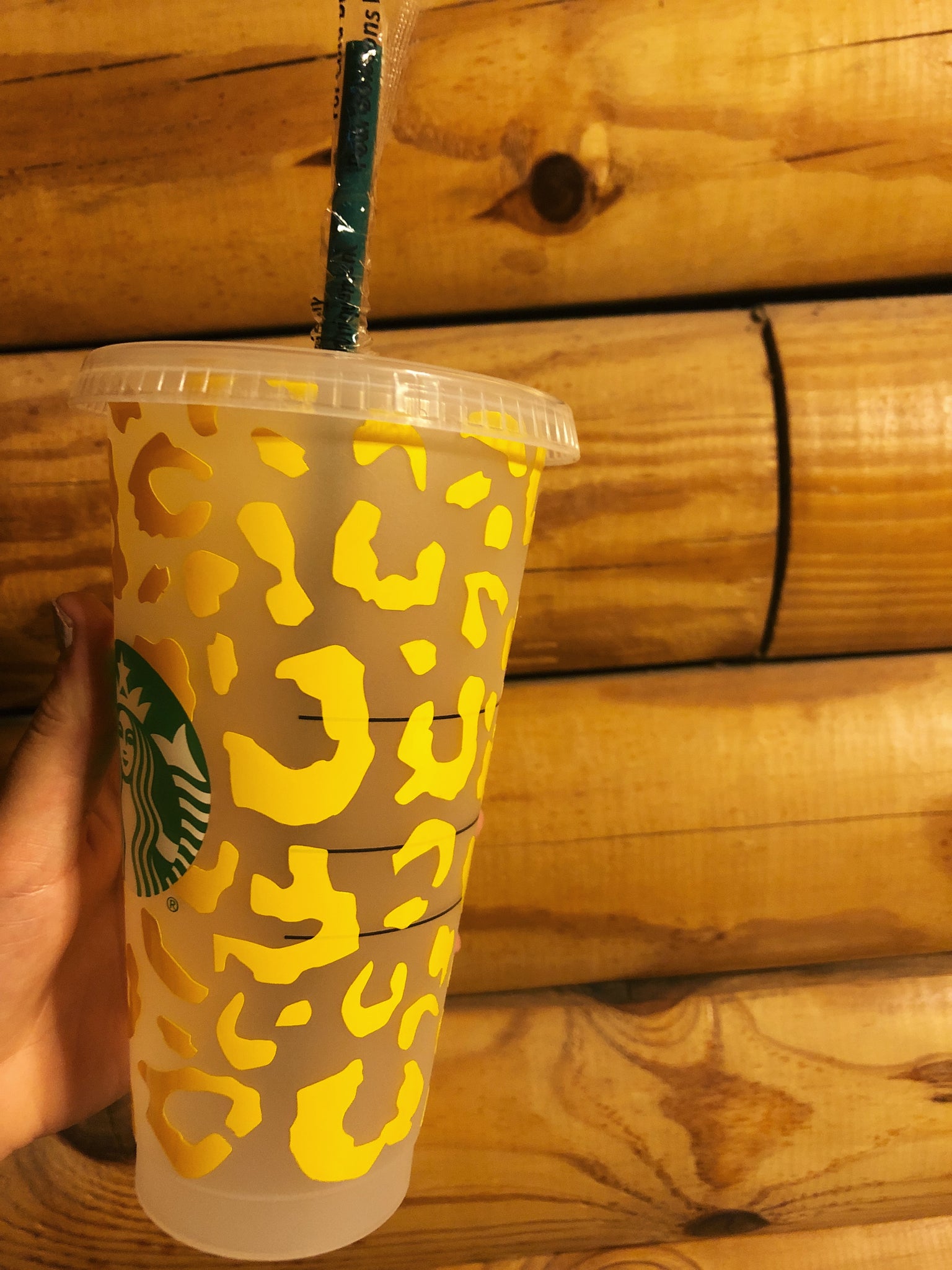 Pink starbucks cup with yellow straws